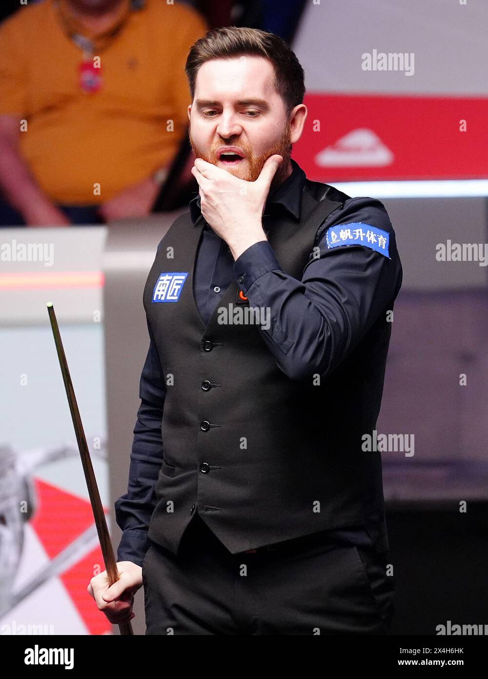 Jak Jones reacts during their semi-final match against Stuart Bingham (not pictured) on day fourteen of the 2024 Cazoo World Snooker Championship at the Crucible Theatre, Sheffield. Picture date: Friday May 3, 2024. Stock Photo