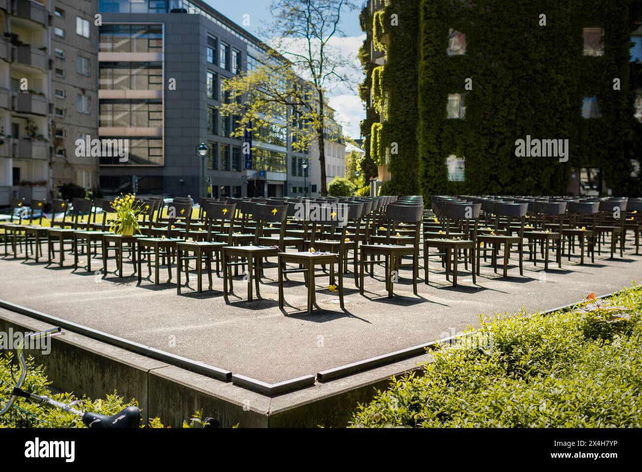 Holocaust memorial with 140 empty bronze chairs. The plateau is located where the former synagogue was built. Place of dark German history in Saxony. Stock Photo