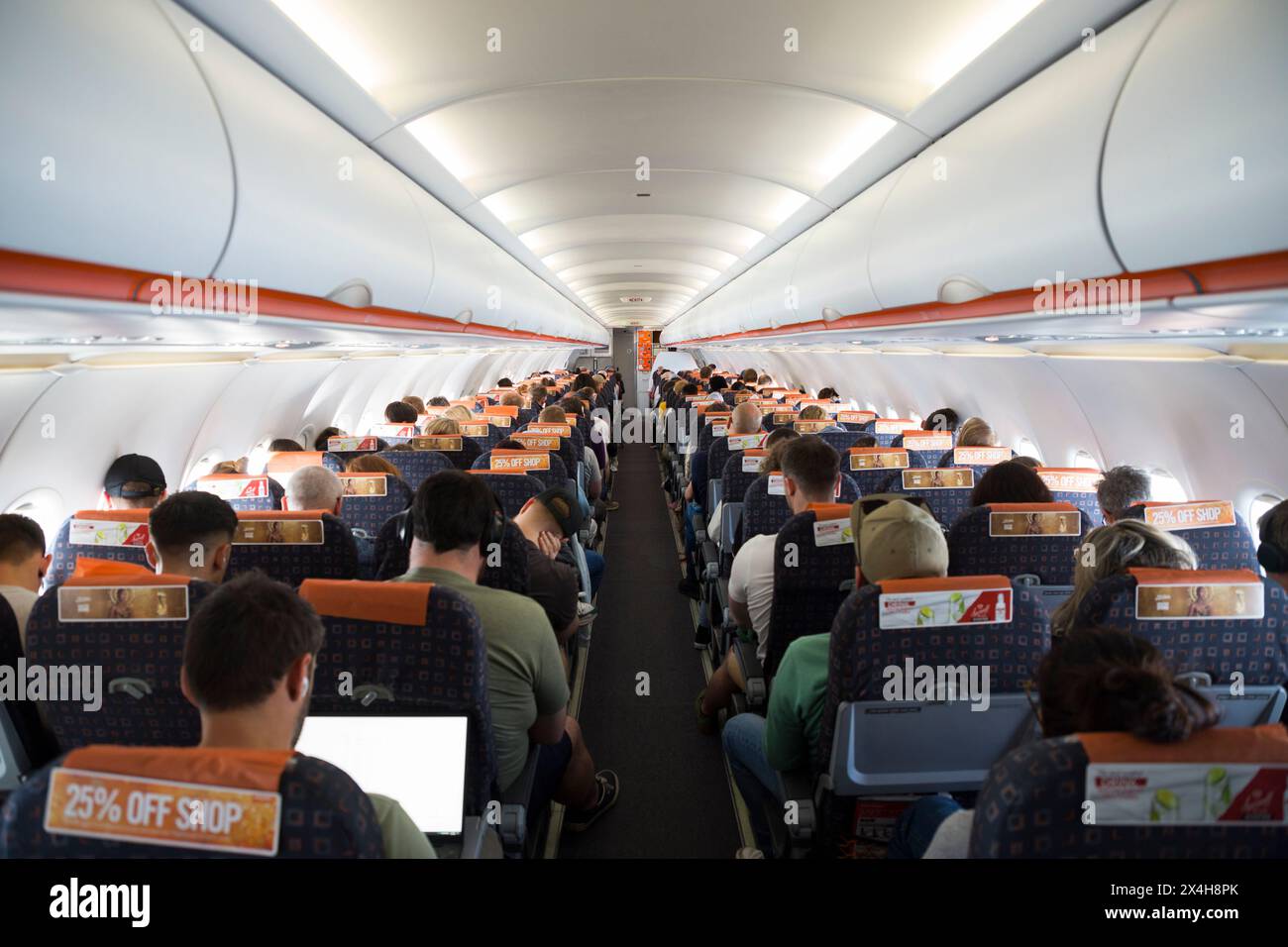 The cabin inside fuselage views down central aisle on a on an Easyjet ...