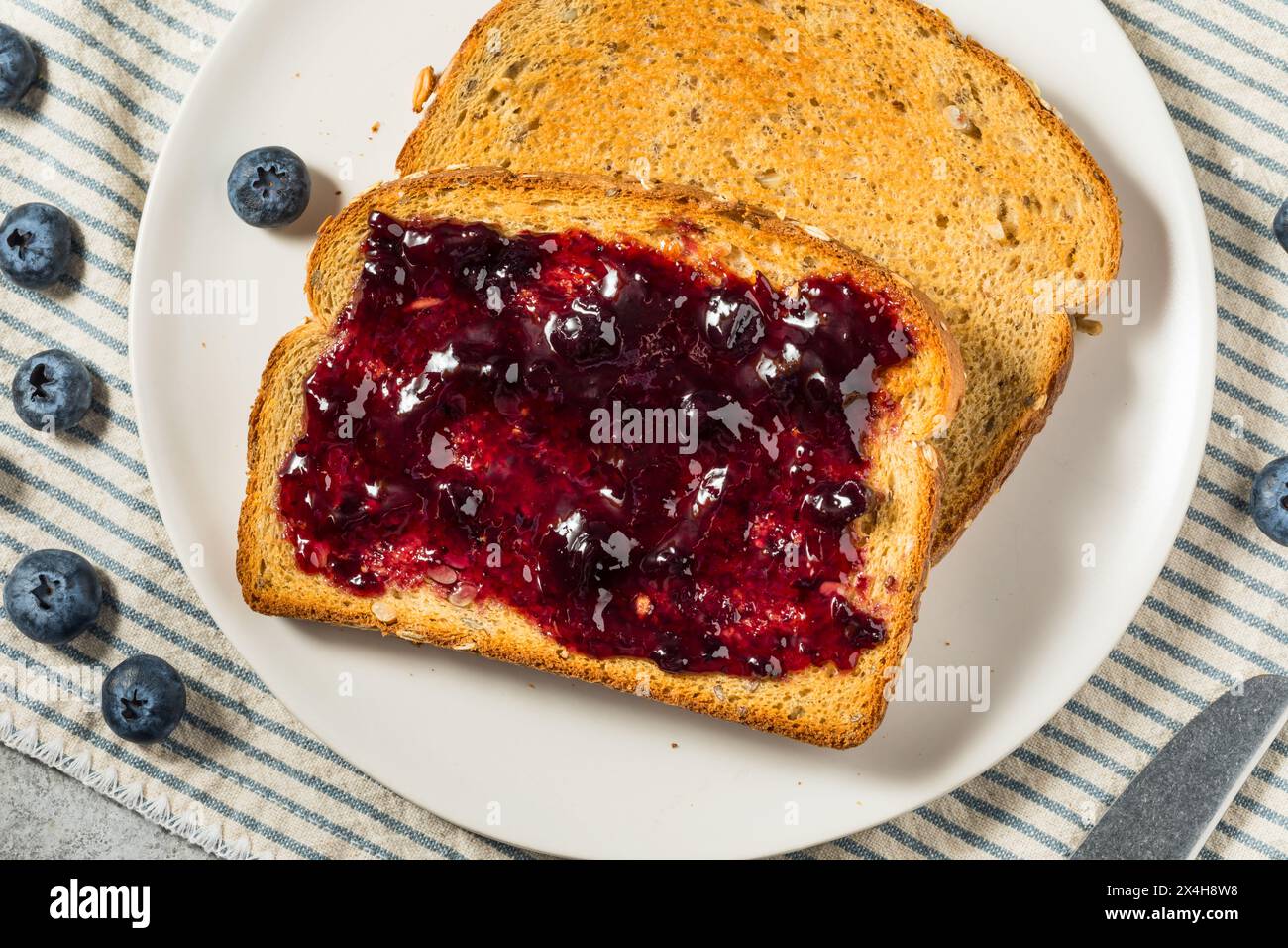 Healthy Homemade Blueberry Jam and Toast for Breakfast Stock Photo