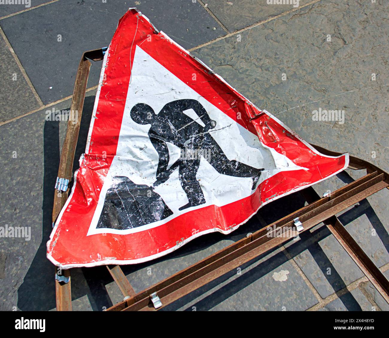 Glasgow, Scotland, UK. 3rd May, 2024: UK Weather: Damaged run over  overturned men at work  road sign meaning bot at work. Sunny summer like weather in the city centre. Credit Gerard Ferry/Alamy Live News Stock Photo