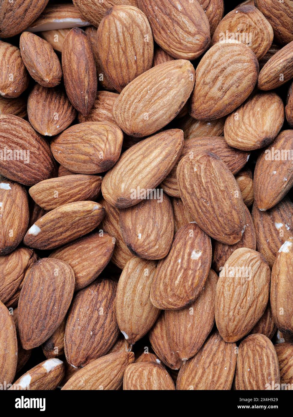 Whole almonds - nutritious and versatile! Packed with vitamins, minerals, and fiber. Perfect for snacking, baking, and adding crunch to dishes. Stock Photo