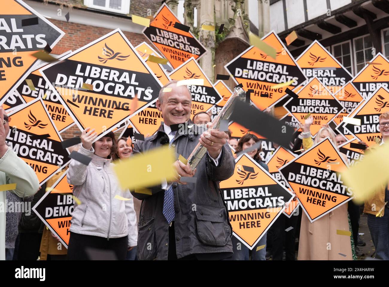 Liberal Democrat leader Sir Ed Davey, fires a confetti cannon as he joins local Lib Dem campaigners at a celebratory rally in Winchester, following the results in local government elections. Picture date: Friday May 3, 2024. Stock Photo