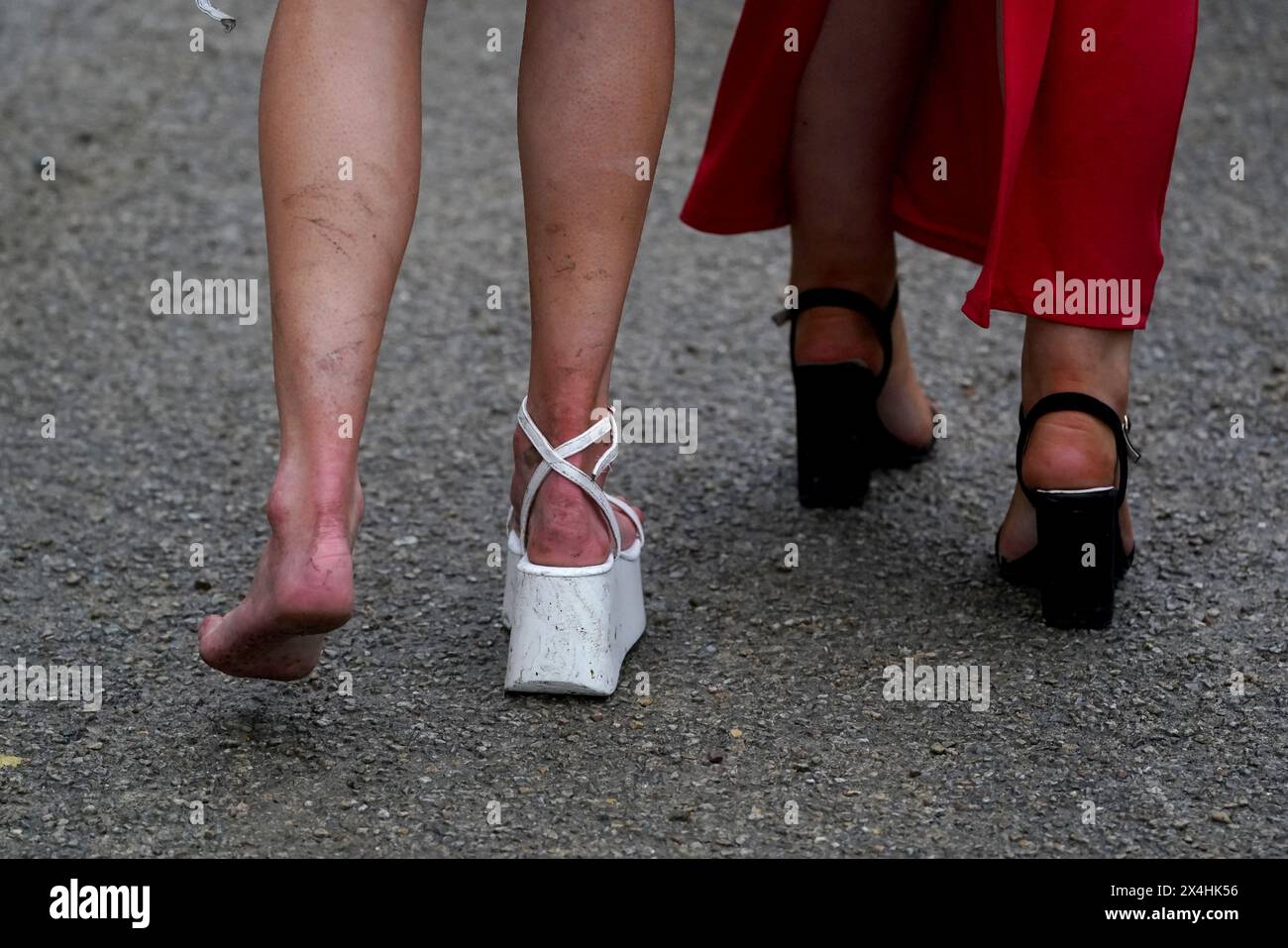 A racegoer missing a shoe during day four of the Punchestown Festival at Punchestown Racecourse, County Kildare. Picture date: Friday May 3, 2024. Stock Photo