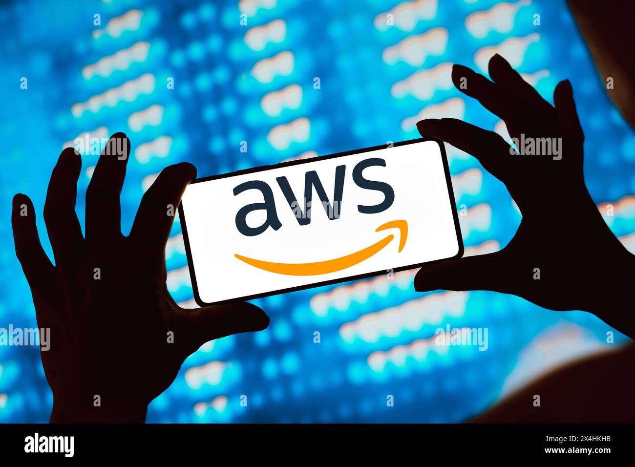 In this photo illustration, the Amazon Web Services (AWS) logo is displayed on a smartphone screen. Stock Photo