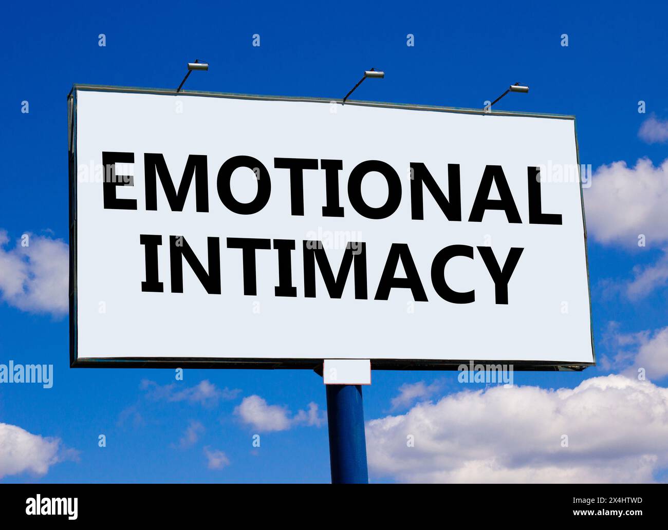 Emotional intimacy symbol. Concept words Emotional intimacy on beautiful white billboard. Beautiful blue sky white cloud background. Psychology emotio Stock Photo