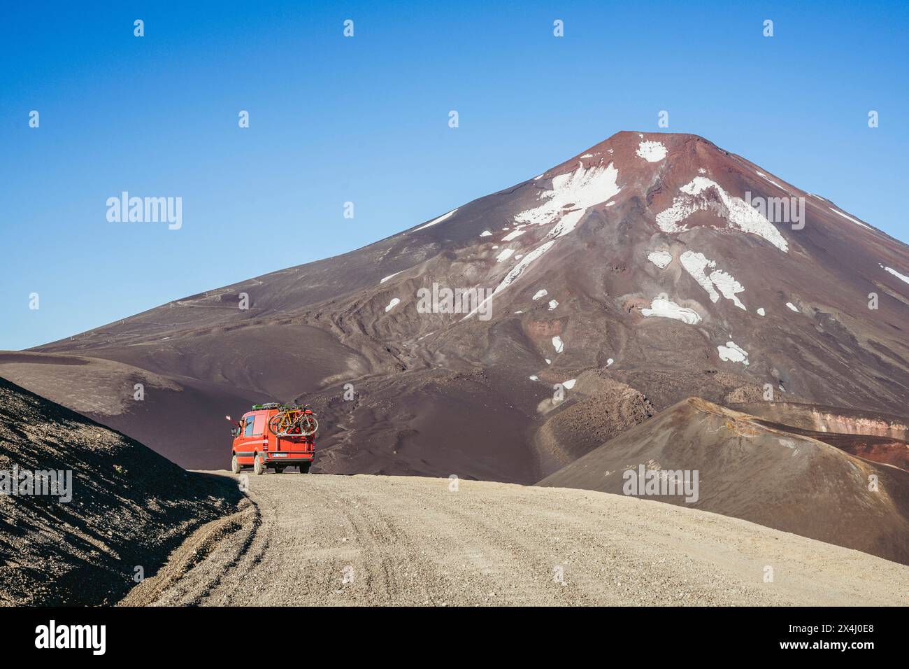 Campervan in front of the Lonquimay volcano, Lonquimay volcano, Malalcahuello National Reserve, Curacautin, Araucania, Chile Stock Photo