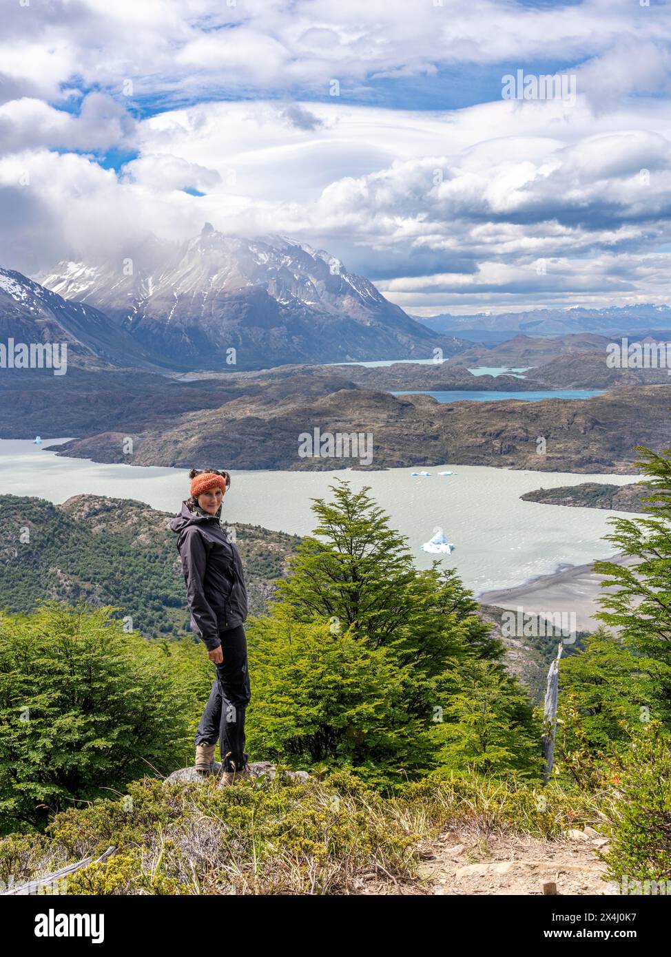 Young woman standing in front of Lago Grey, Hike to Ferrier lookout, Torres de Paine, Magallanes and Chilean Antarctica, Chile, South America Stock Photo