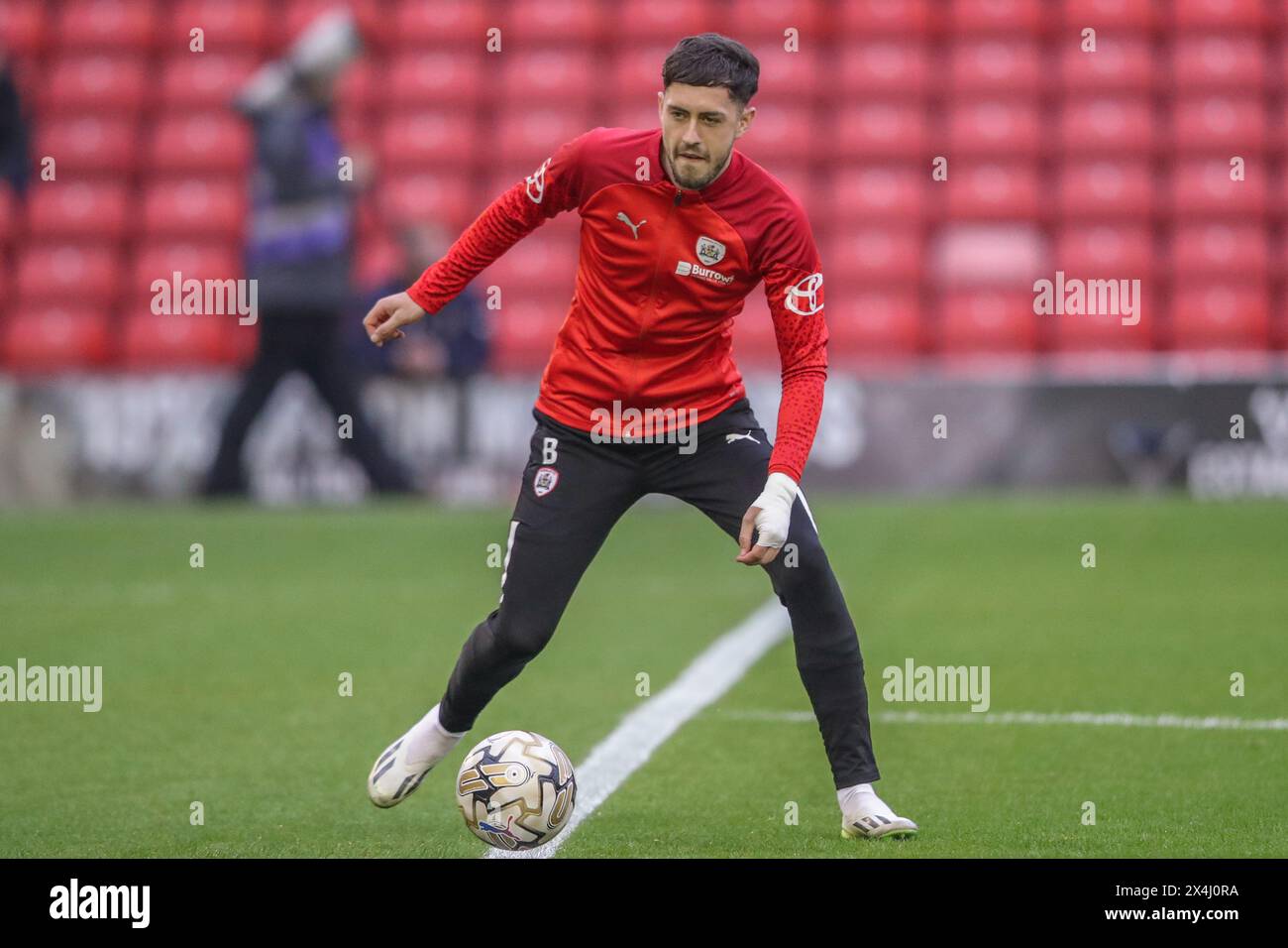 Corey O'Keeffe of Barnsley in the pregame warmup session during the Sky Bet League 1 Sky Bet League 1 Promotion Play-offs Semi-final first leg match Barnsley vs Bolton Wanderers at Oakwell, Barnsley, United Kingdom, 3rd May 2024  (Photo by Alfie Cosgrove/News Images) Stock Photo