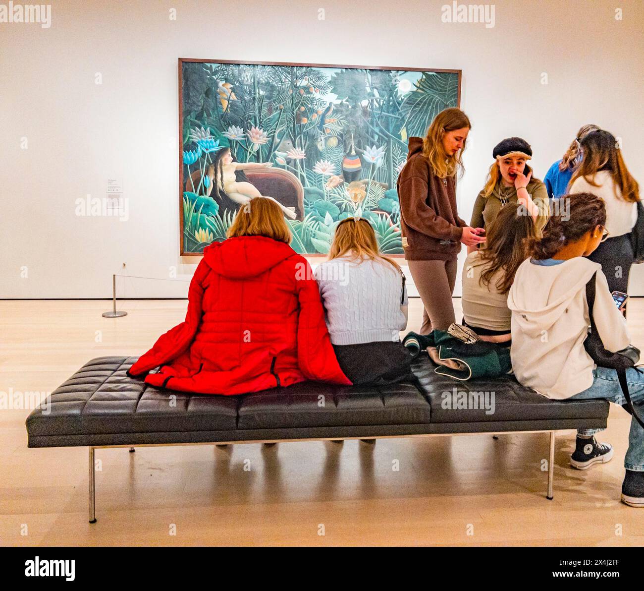 Visitors in front of the painting The Dream by Henri Julien Felix ...