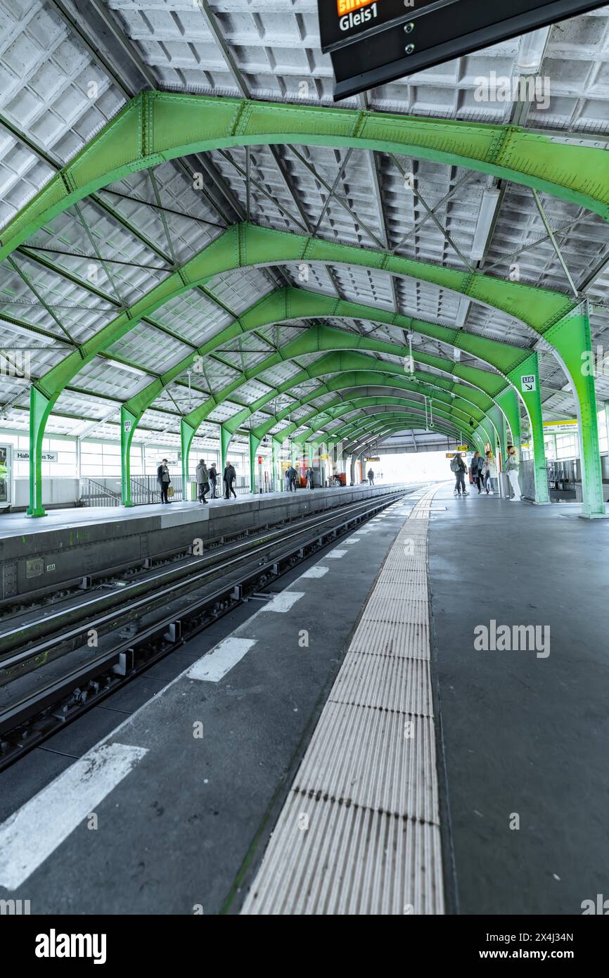 S-Bahn station with striking green roof and empty tracks on a bright day, Berlin, Germany Stock Photo