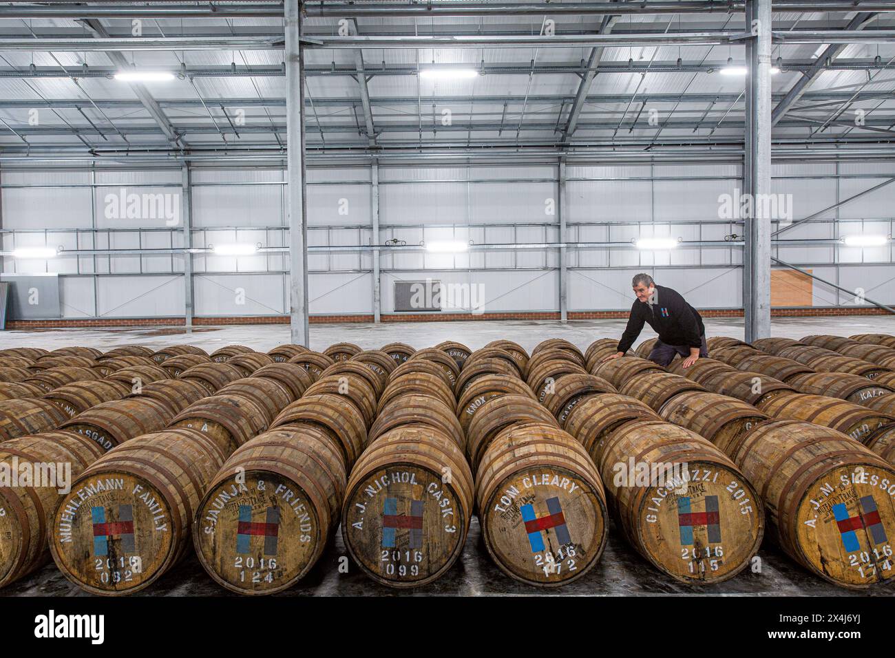 Isle of Harris whisky barrels in warehouse Stock Photo