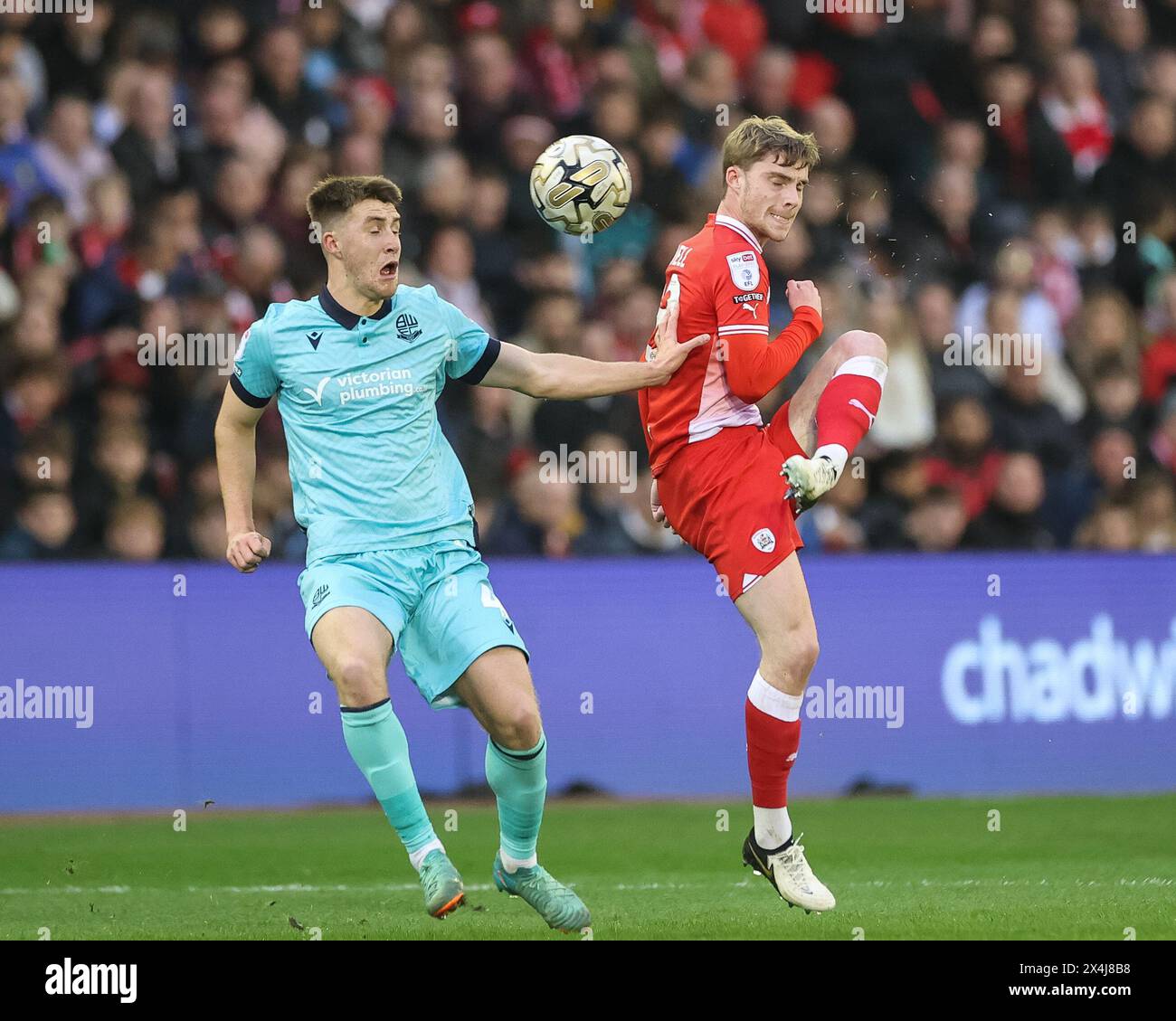 Luca Connell of Barnsley clears the ball up field during the Sky Bet League 1 Promotion Play-offs Semi-final first leg match Barnsley vs Bolton Wanderers at Oakwell, Barnsley, United Kingdom, 3rd May 2024  (Photo by Mark Cosgrove/News Images) Stock Photo