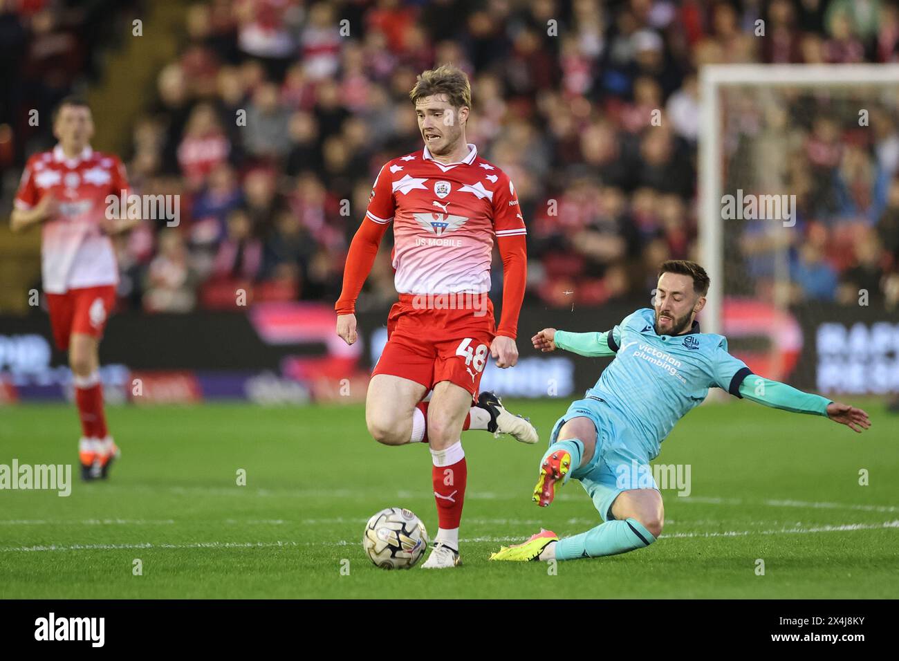 Luca Connell of Barnsley breaks with the ball during the Sky Bet League 1 Promotion Play-offs Semi-final first leg match Barnsley vs Bolton Wanderers at Oakwell, Barnsley, United Kingdom, 3rd May 2024  (Photo by Mark Cosgrove/News Images) Stock Photo
