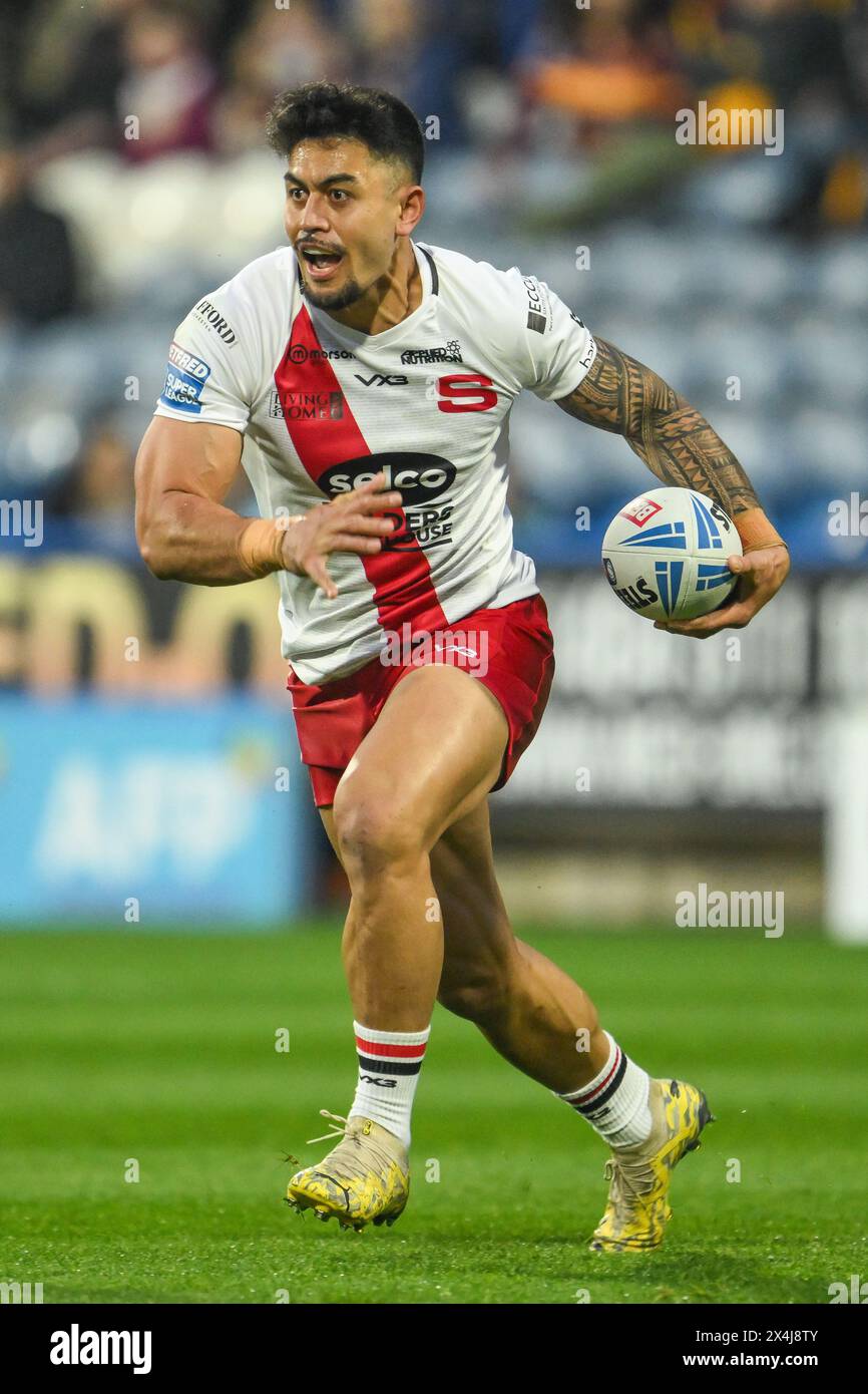 Tim Lafai of Salford Red Devils makes a break during the Betfred Super League Round 10 match Huddersfield Giants vs Salford Red Devils at John Smith's Stadium, Huddersfield, United Kingdom, 3rd May 2024  (Photo by Craig Thomas/News Images) Stock Photo
