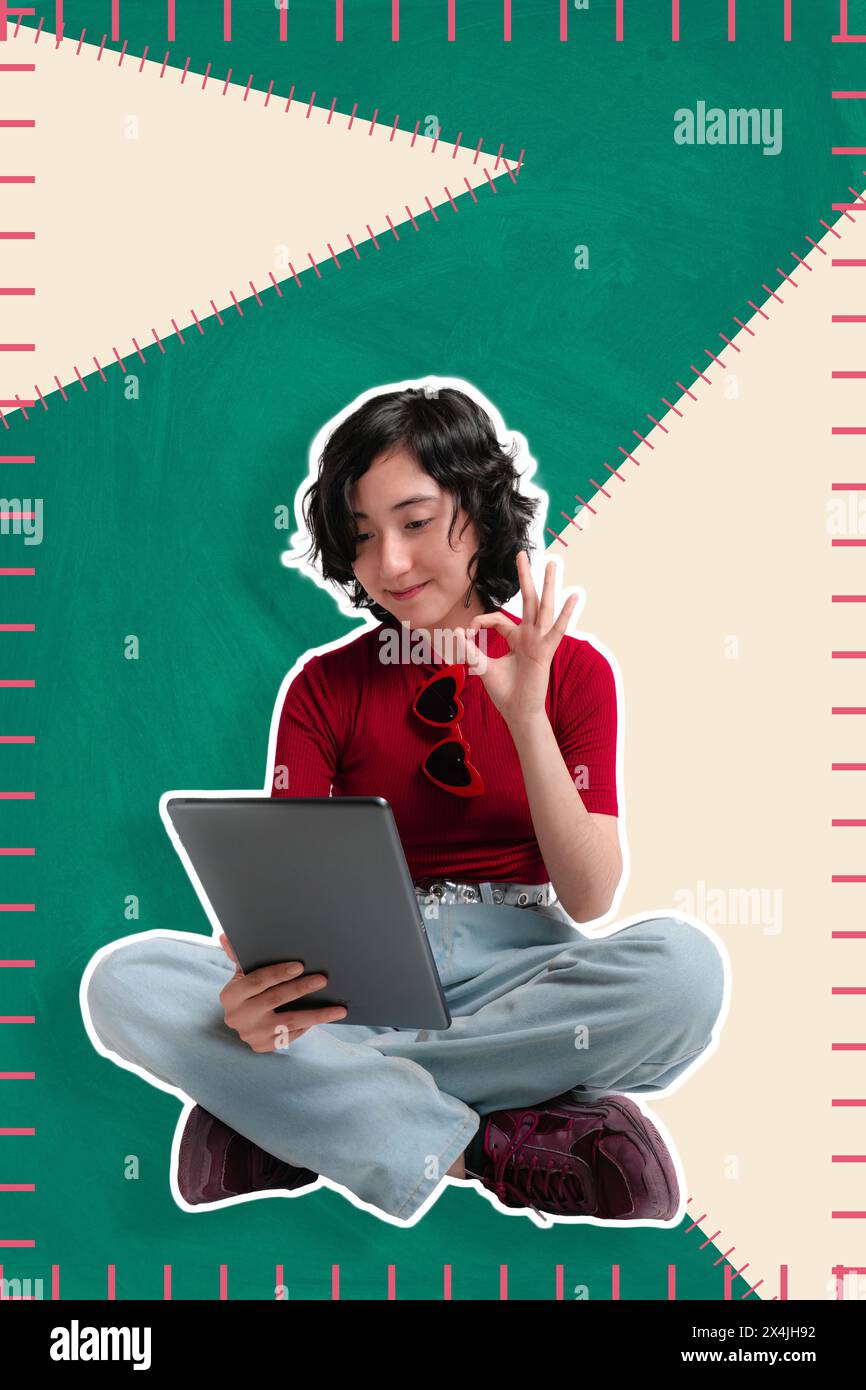 Young girl is sitting making a video call from her tablet, ok expression, ideal for social media banner. copy space Stock Photo