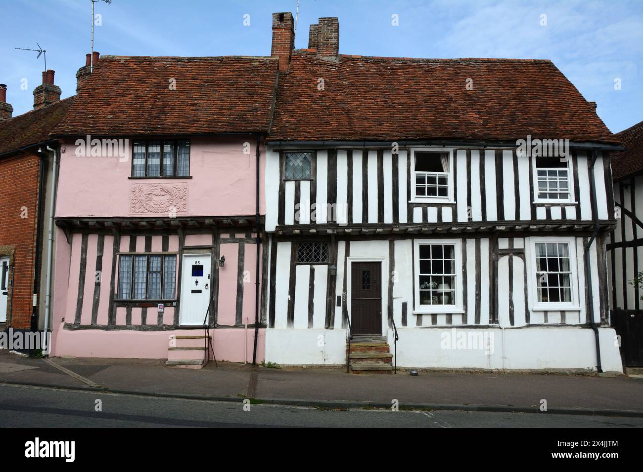 Old medieval half-timbered 'crooked houses' in the village of Lavenham in Suffolk county, England, United Kingdom. Stock Photo