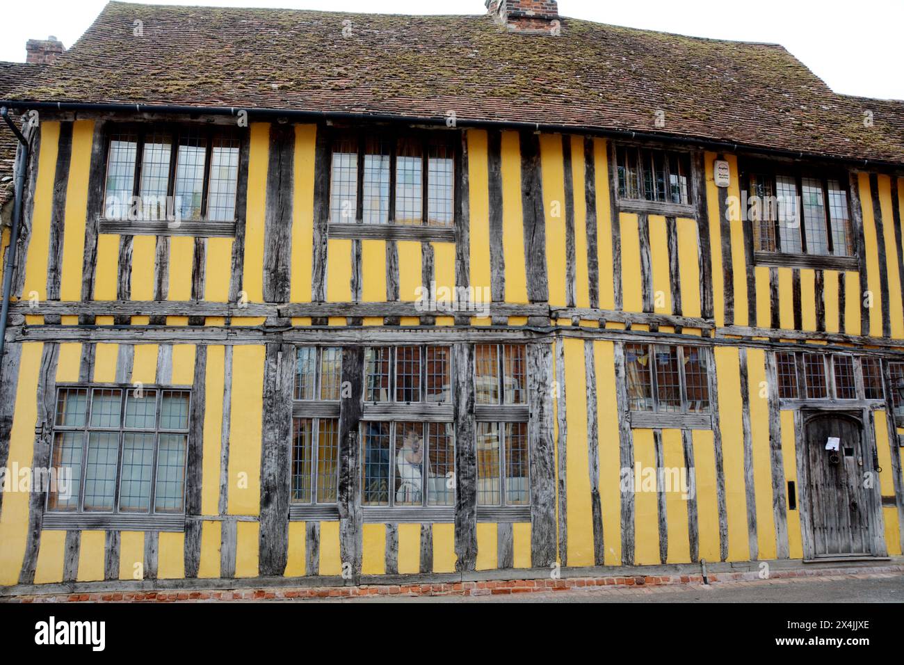 Old medieval half-timbered 'crooked houses' in the village of Lavenham in Suffolk county, England, United Kingdom. Stock Photo