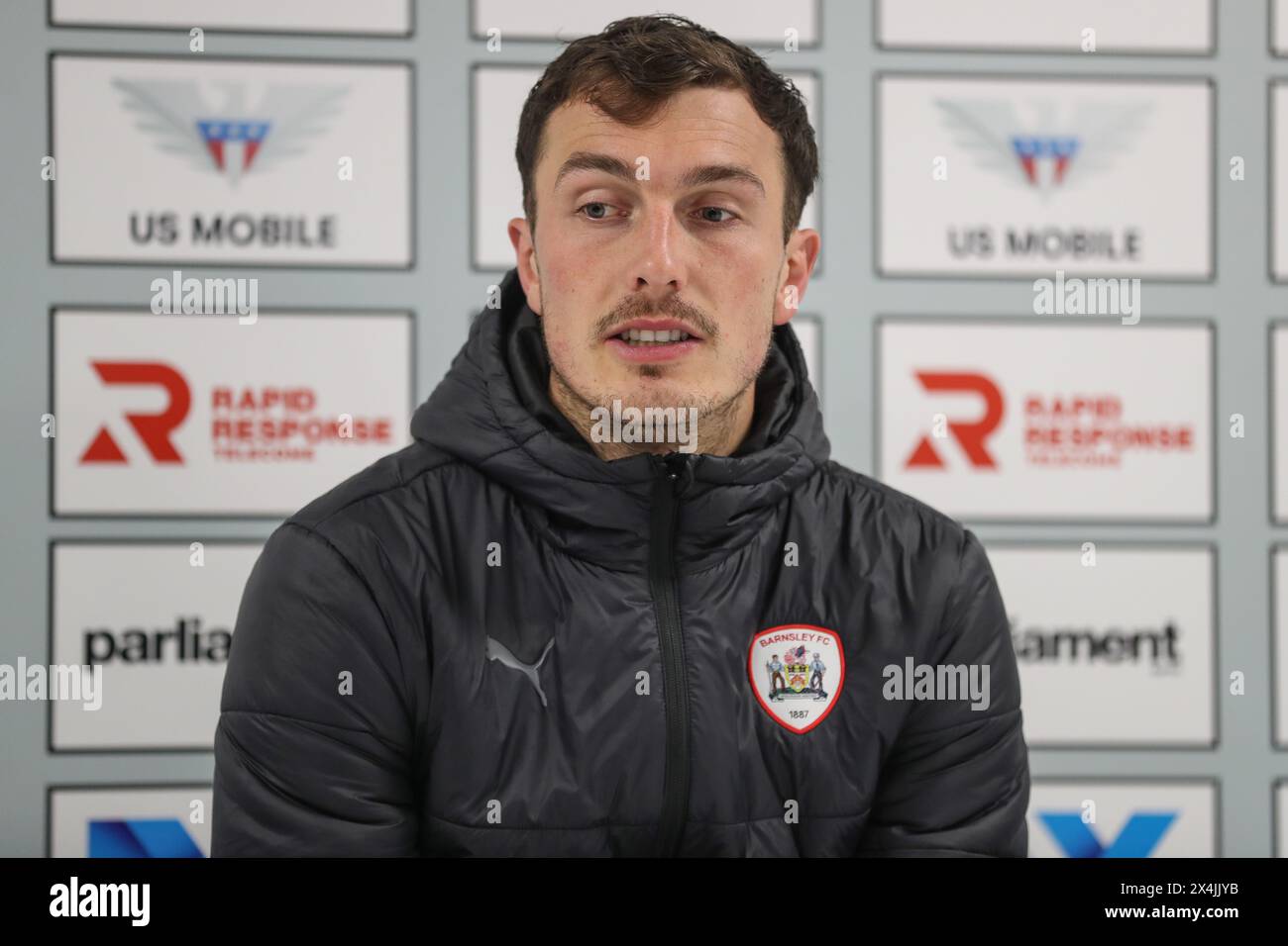 Josh Earl of Barnsley speaks in the post match press conference during the Sky Bet League 1 Sky Bet League 1 Promotion Play-offs Semi-final first leg match Barnsley vs Bolton Wanderers at Oakwell, Barnsley, United Kingdom, 3rd May 2024  (Photo by Alfie Cosgrove/News Images) Stock Photo