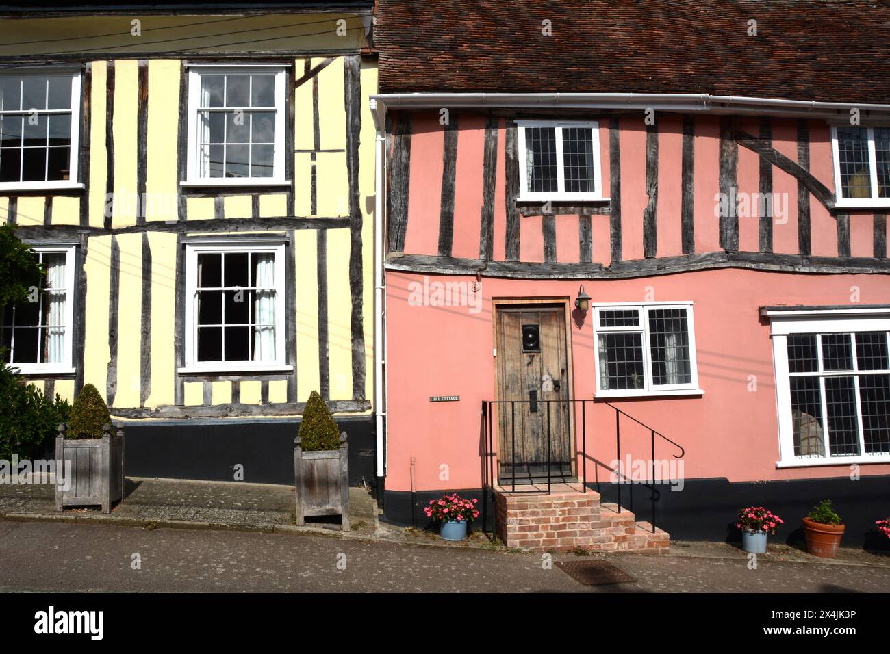 Old medieval half-timbered 'crooked houses' in the village of Lavenham in Suffolk county, England, United Kingdom. Stock Photo