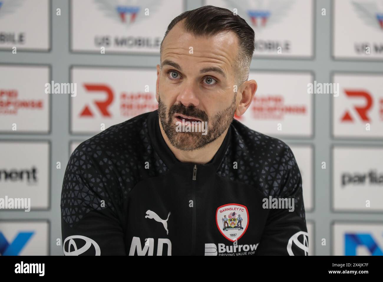 Martin Devaney caretaker manager of Barnsley speaks at the post match press conference during the Sky Bet League 1 Sky Bet League 1 Promotion Play-offs Semi-final first leg match Barnsley vs Bolton Wanderers at Oakwell, Barnsley, United Kingdom, 3rd May 2024  (Photo by Alfie Cosgrove/News Images) Stock Photo