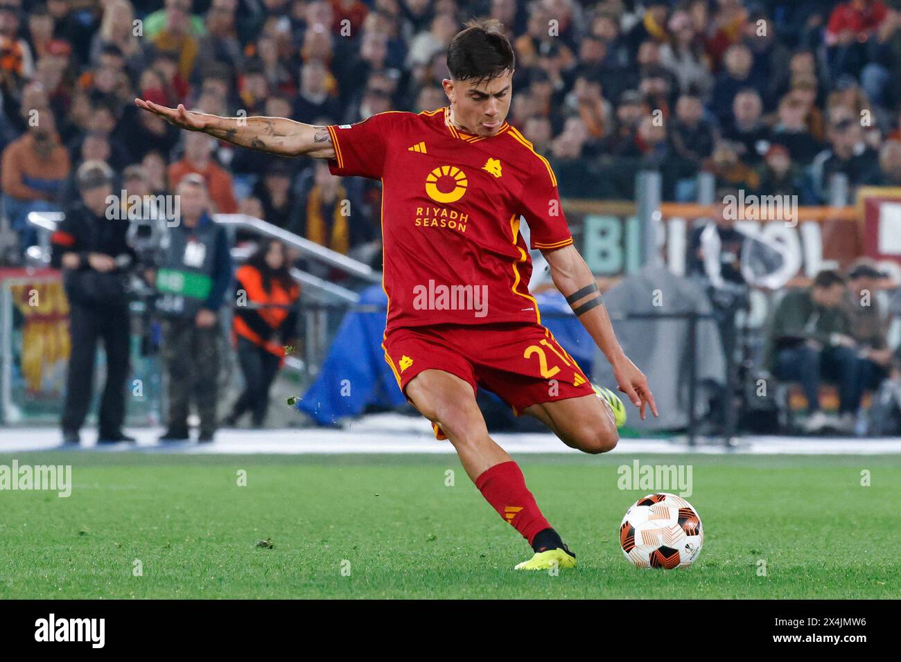 Rome, Italy, May 2, 2024. Paulo Dybala, of AS Roma, kicks the ball during the UEFA Europa League semifinal first leg football match between Roma and Bayer Leverkusen at the Olympic Stadium. Stock Photo