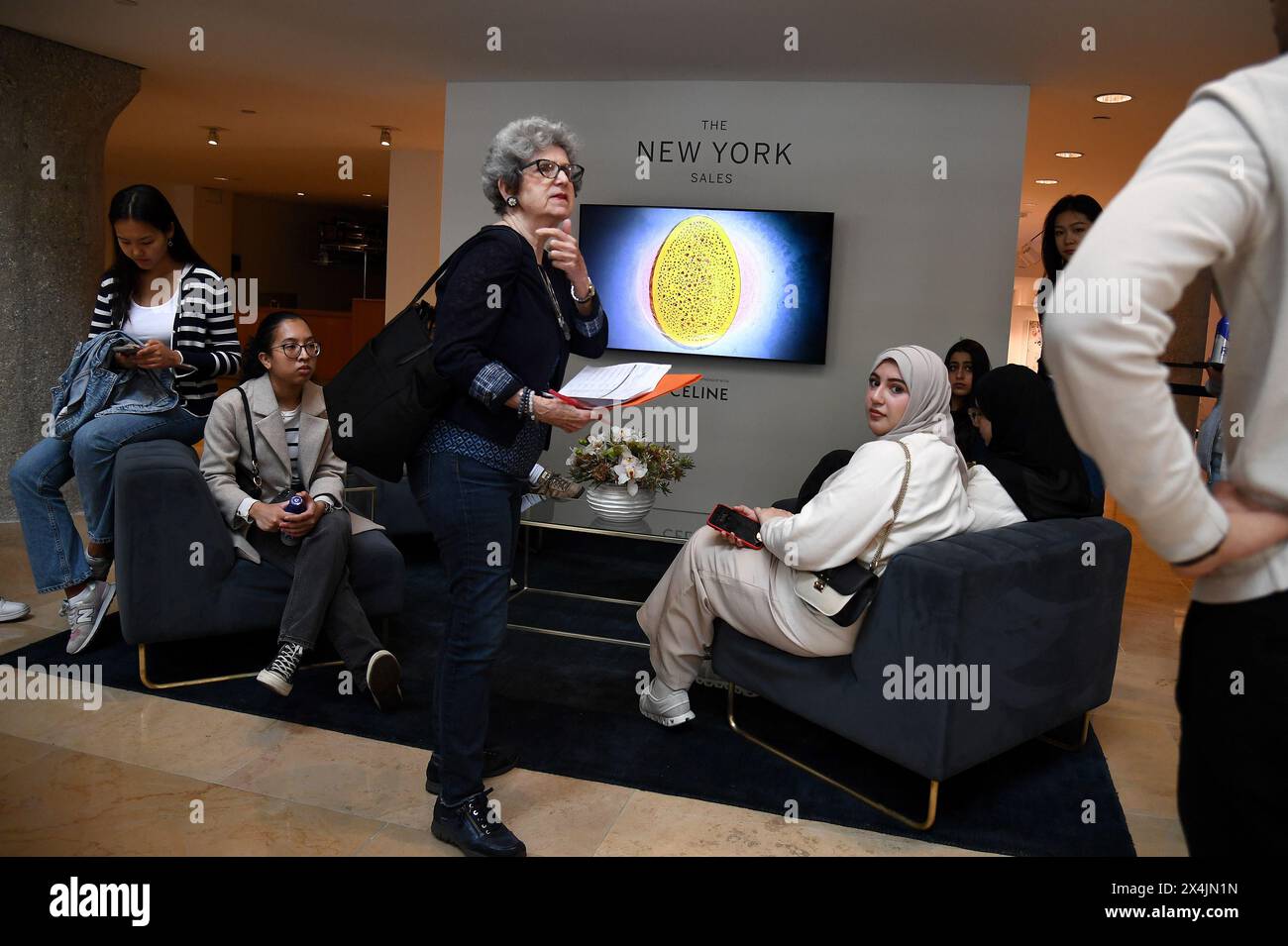 New York, USA. 03rd May, 2024. Visitors sit in the lobby of Sotheby's auction house on opening day of public exhibitions for Sotheby's marquee contemporary and Modern art auctions, New York, NY, May 3, 2024. (Photo by Anthony Behar/Sipa USA) Credit: Sipa USA/Alamy Live News Stock Photo