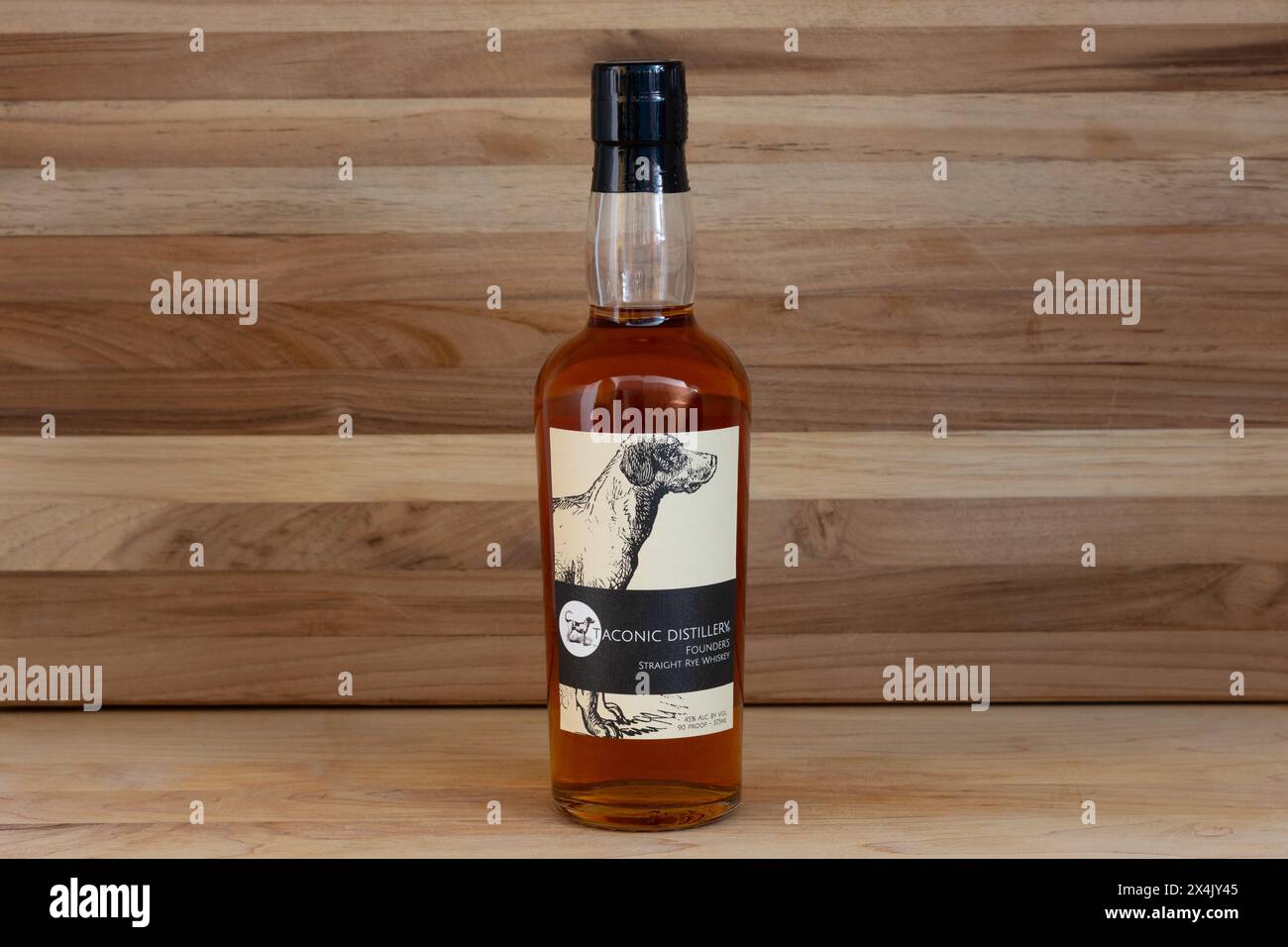 bottle of straight rye whiskey from Taconic Distillery in Hudson Valley New York on a rustic wood background with copy space Stock Photo
