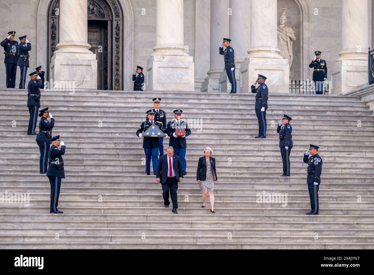April 29, 2024 - Washington, District of Columbia, USA - A military body bearer team carries an urn with the cremated remains of Colonel Ralph Puckett, Jr., the last living Korean War Medal of Honor recipient, down the steps of the U.S. Capitol, April 29, 2024. The U.S. Army veteran passed away April 8, 2024, at the age of 97. (Credit Image: © Bernardo Fuller/U.S. Army/ZUMA Press Wire) EDITORIAL USAGE ONLY! Not for Commercial USAGE! Stock Photo