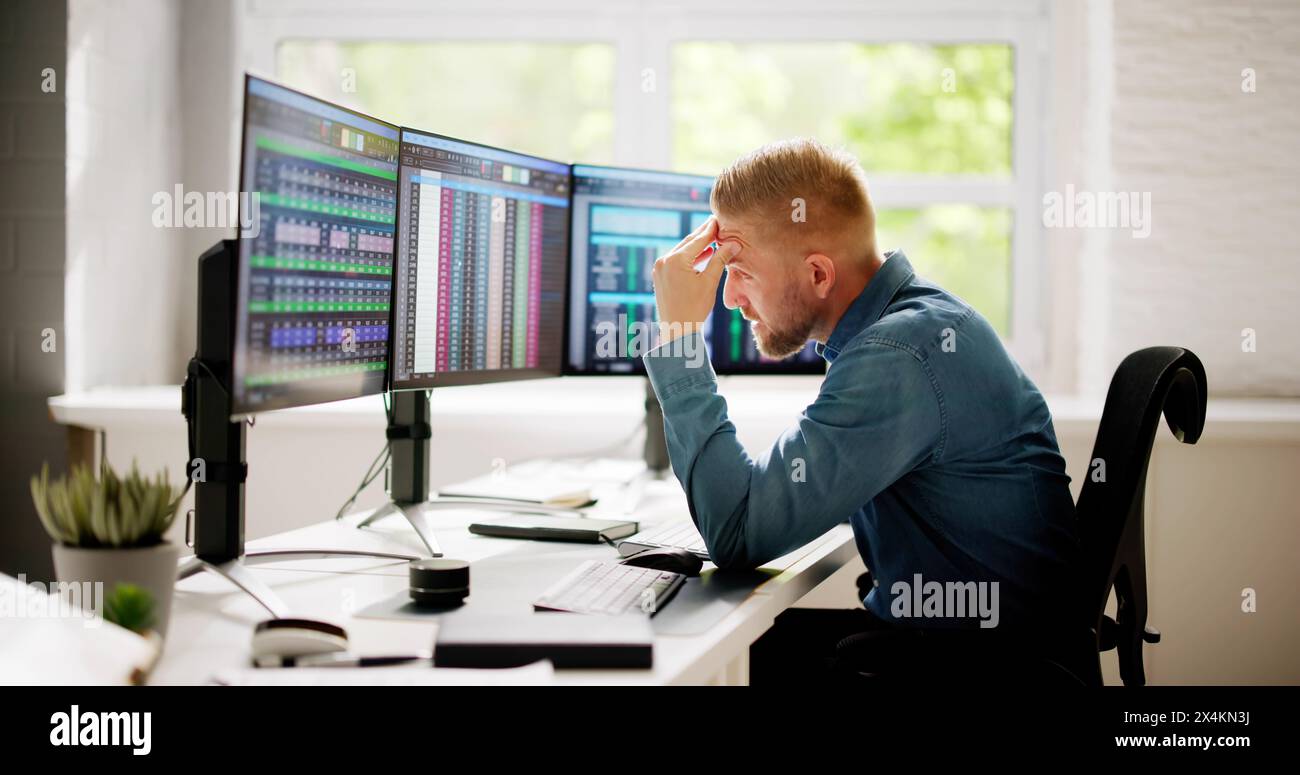 Data Analyst Man Using Spreadsheet On Computer Stock Photo