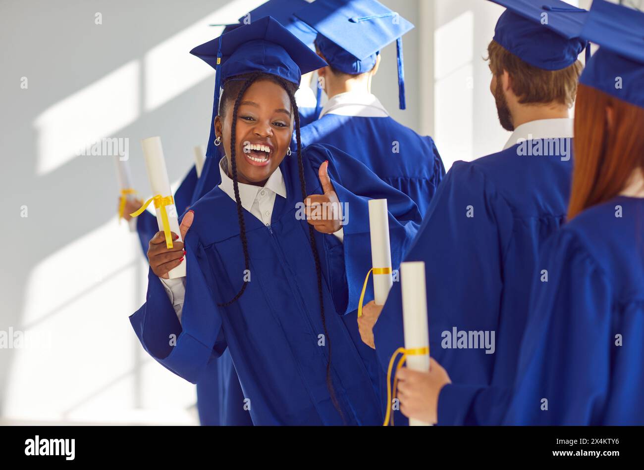 Black female graduate celebrates hi-res stock photography and images ...