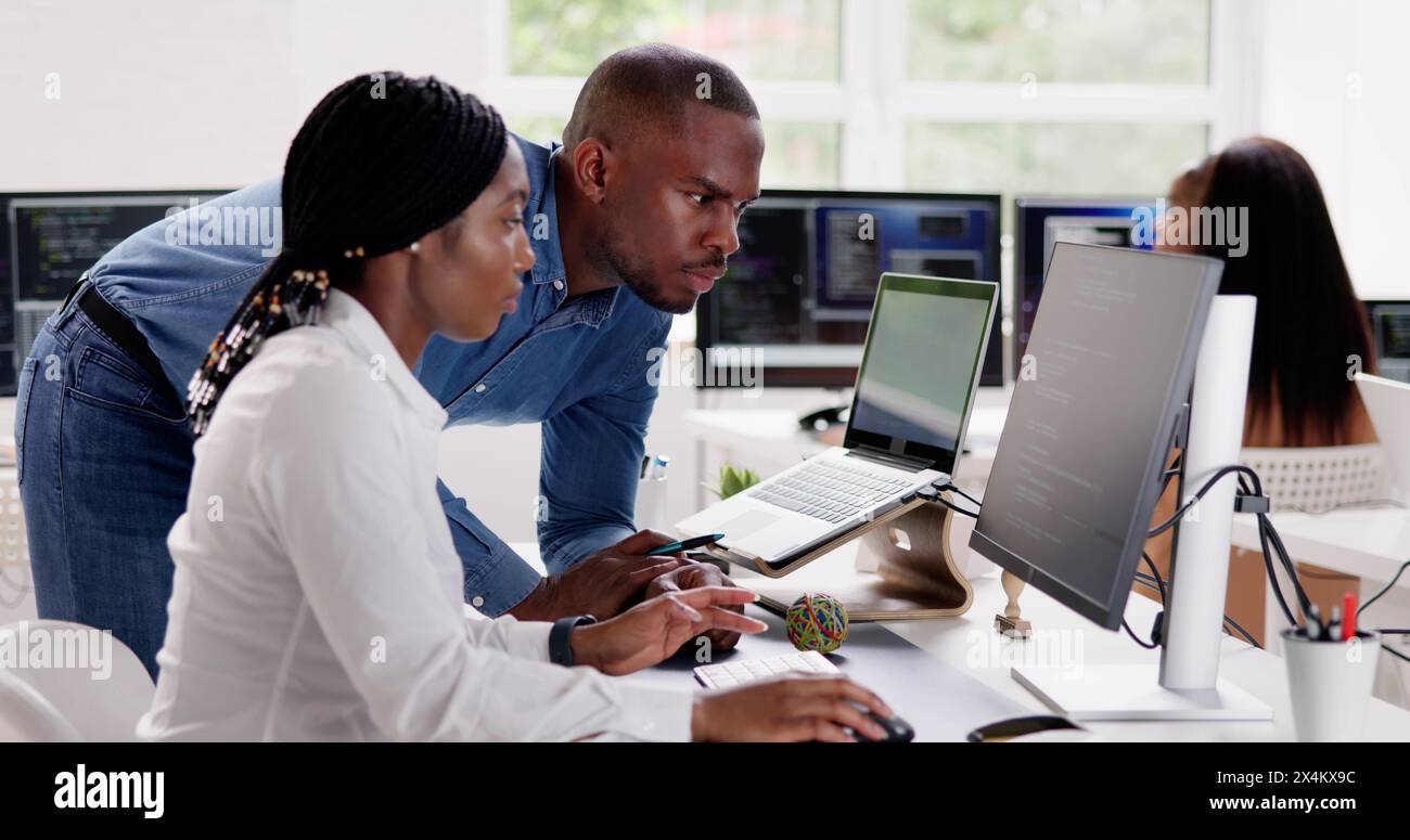 African team of programmers working on computer code business Stock Photo