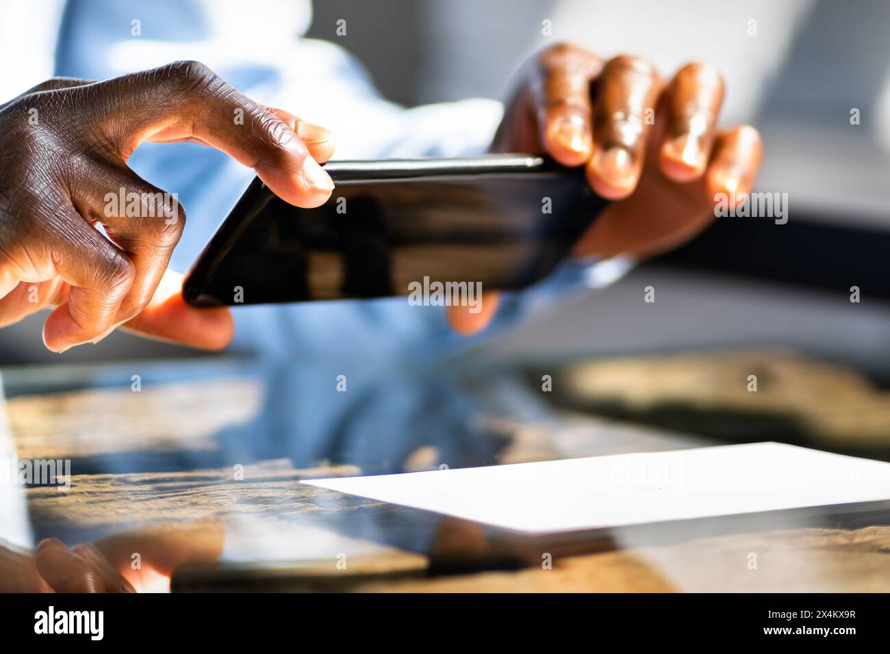 Man depositing a check with mobile phone picture stock photo alamy