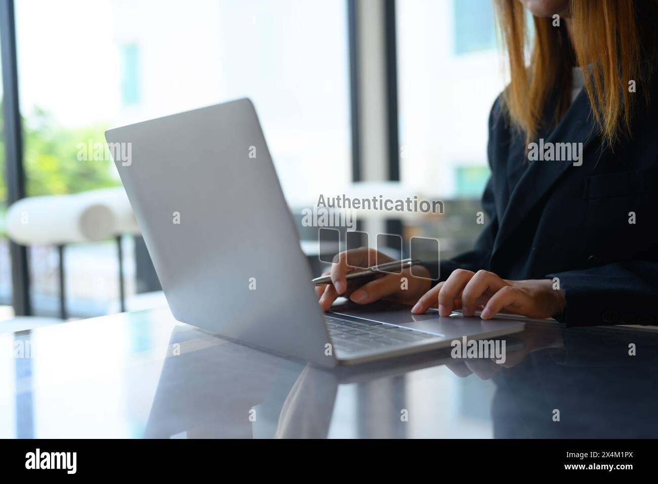 Businesswoman hands entering the PIN code on her laptop. Cyber security ...
