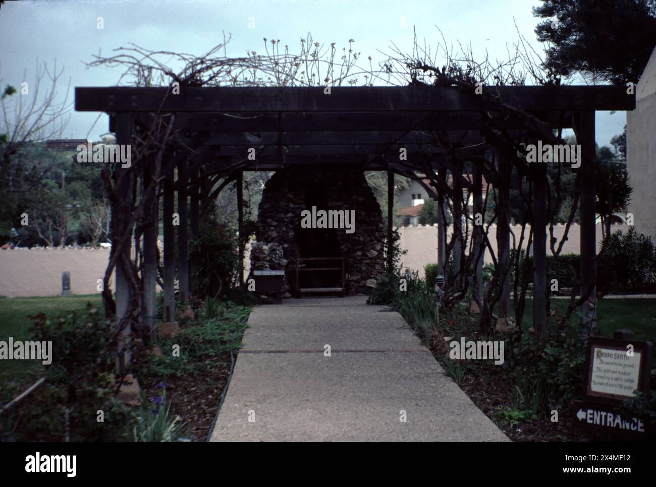 Solvang, CA. USA. Circa 1981. Mission Santa Inés (sometimes spelled Santa Ynez) was a Spanish mission in present-day Solvang, California, United States, and named after St. Agnes of Rome. Founded on September 17, 1804, by Father Estévan Tapís of the Franciscan order, the mission site was chosen as a midway point between Mission Santa Barbara and Mission La Purísima Concepción.  This beautify mission still provides services to the local population. Stock Photo