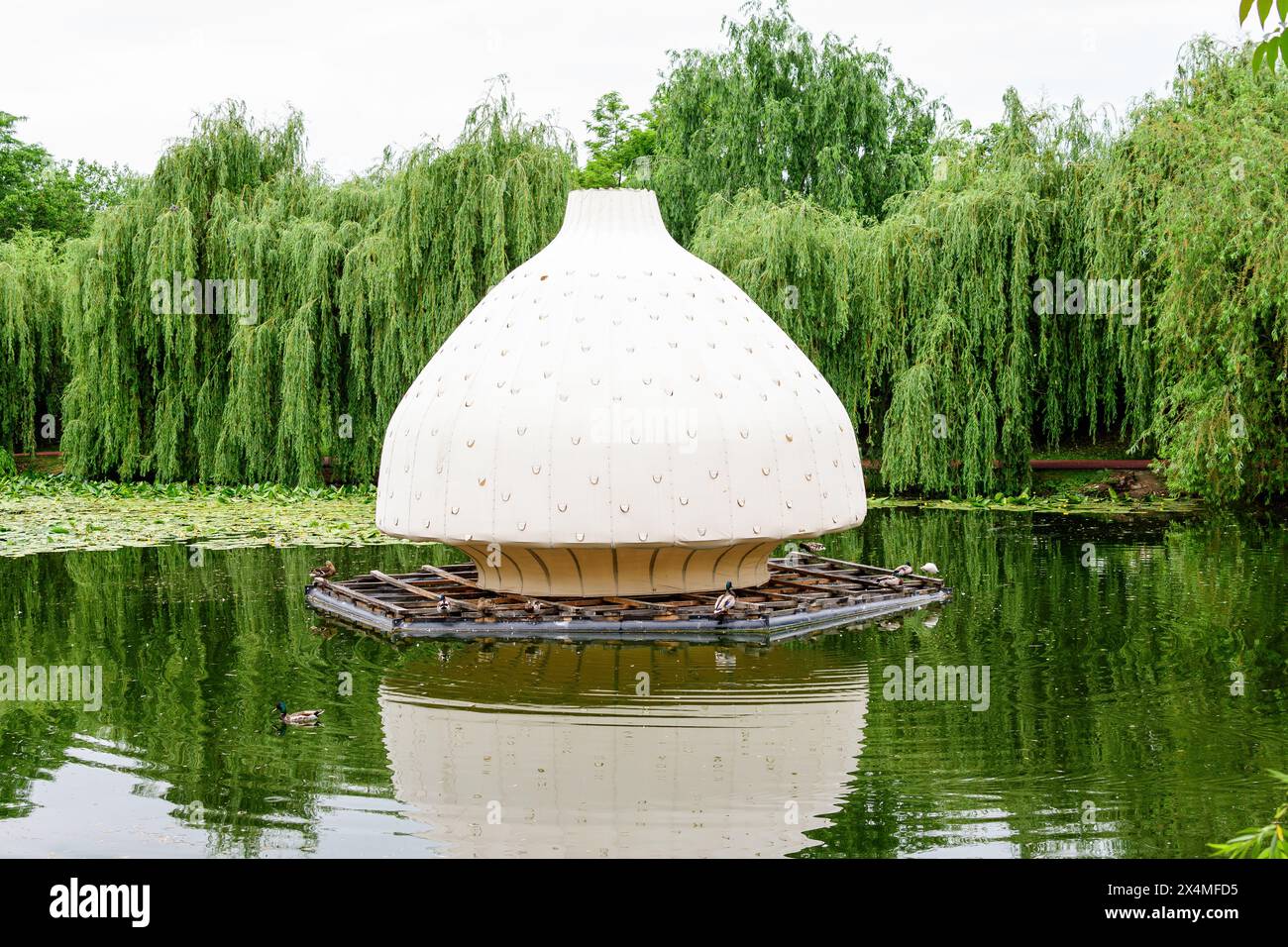 Big Chinese light lantern situated in the center of the lake of Alexandru Buia Botanical Garden from Craiova in Dolj county, Romania, in a spring day Stock Photo