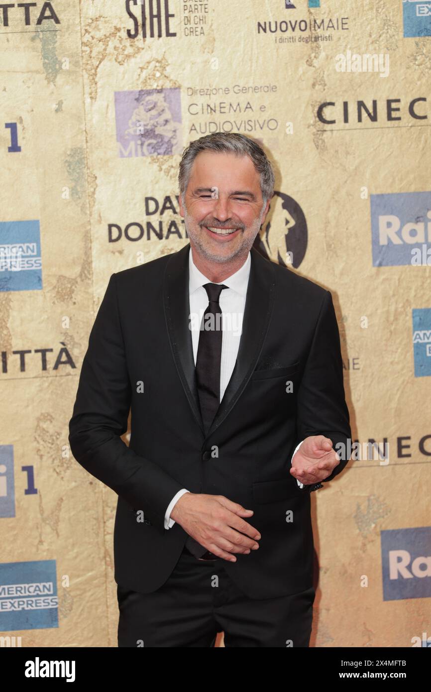 Beppe Convertini attends the red carpet of the David di Donatello 2024 ...