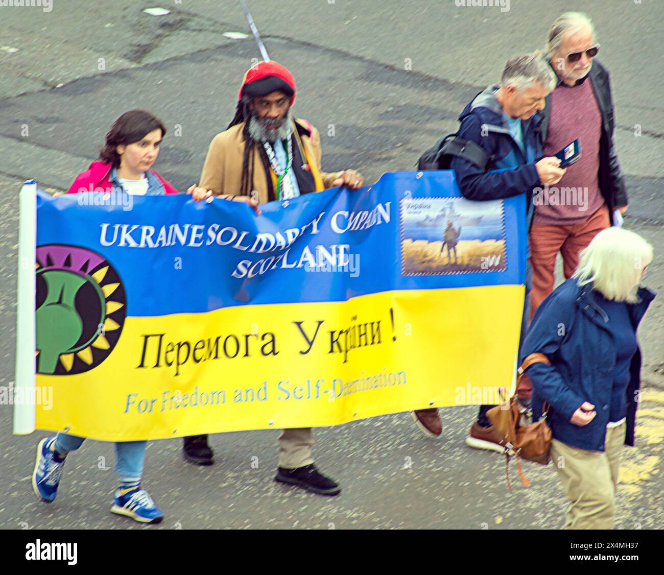 Glasgow, Scotland, UK. 4th May, 2024: Graham Campbell with ukraine banner at   All Under One Banner's (AUOB) March for Independence took place today as they walked through the city to a rally on glasgow green park . Credit Gerard Ferry /Alamy Live News Stock Photo
