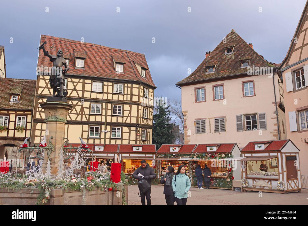 Colmar, France - December 21, 2023: Schwendi fountain by Bartholdi (left) on Old Customs Square Stock Photo