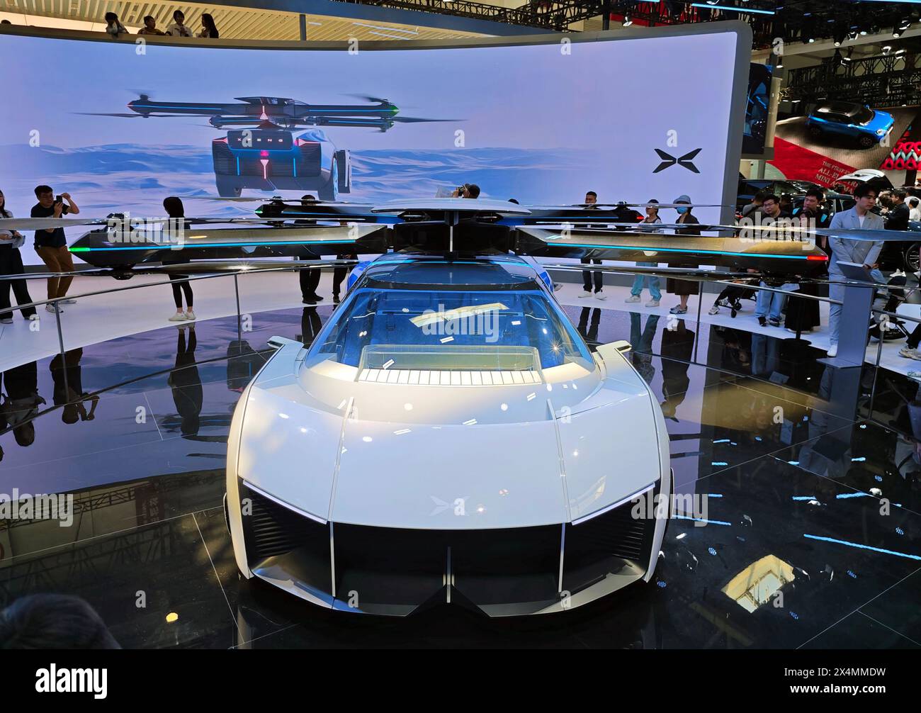 BEIJING, CHINA - MAY 3, 2024 - Visitors watch the Xiaopeng AEROHT Land and Air integrated flying car at the 2024 Beijing International Automotive Exhi Stock Photo