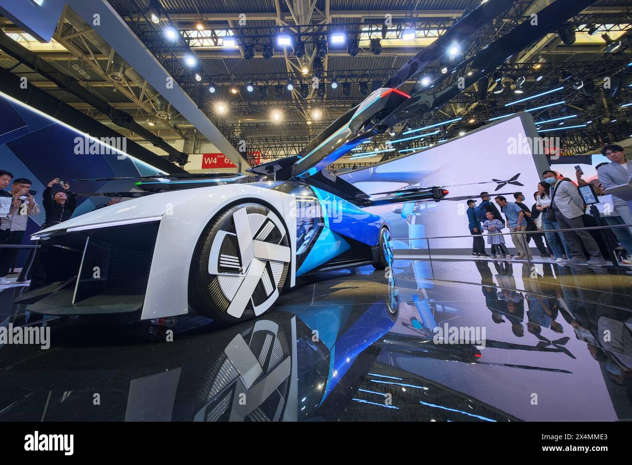 BEIJING, CHINA - MAY 3, 2024 - Visitors watch the Xiaopeng AEROHT Land and Air integrated flying car at the 2024 Beijing International Automotive Exhi Stock Photo