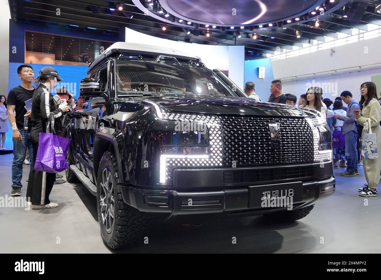 beijing-china-may-3-2024-spectators-look-at-a-u8-electric-cars-at