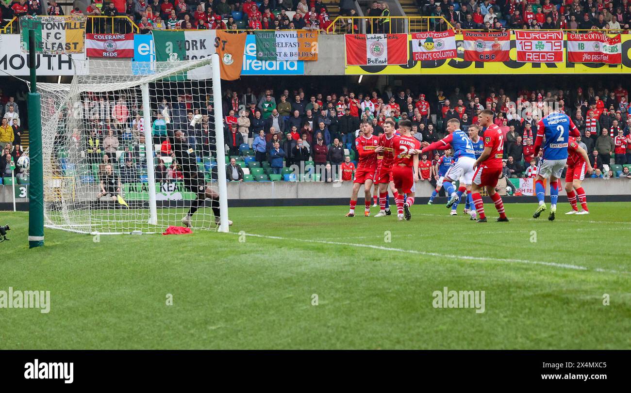 National Football Stadium at Windsor Park, Belfast, Northern Ireland, UK. 04th May 2024. Clearer Water Irish Cup Final 2024. Cliftonville v  Linfield. (Cliftonville - red). Action from today's Irish Cup Final. Ethan McGee heads Linfield ahead and celebrates. Credit: David Hunter/Alamy Live News. Stock Photo