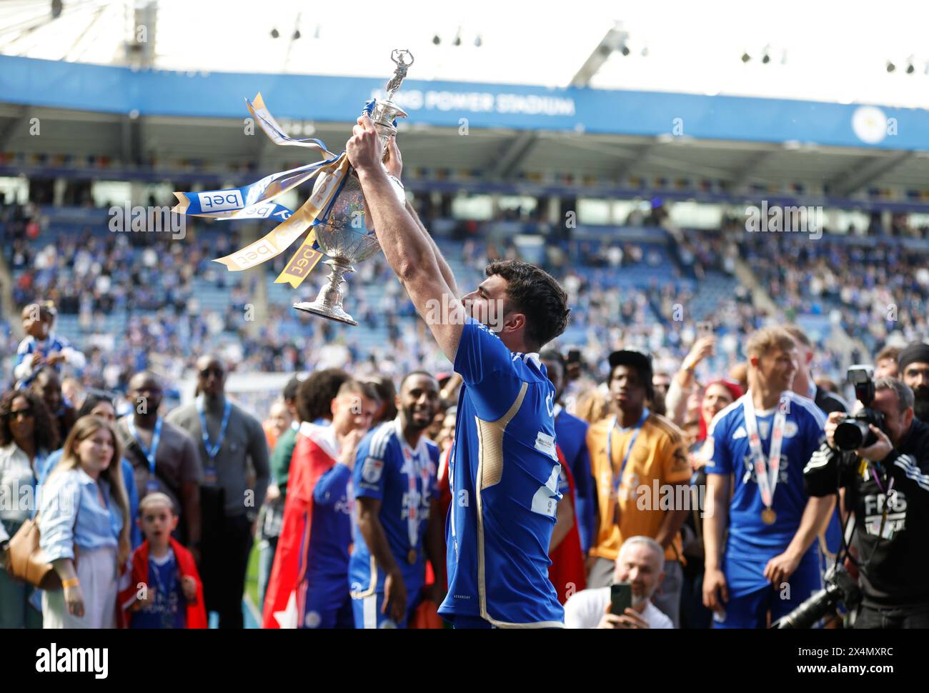 Leicester City's Tom Cannon celebrates with the league trophy after the Sky Bet Championship match at the King Power Stadium, Leicester. Picture date: Saturday May 4, 2024. Stock Photo