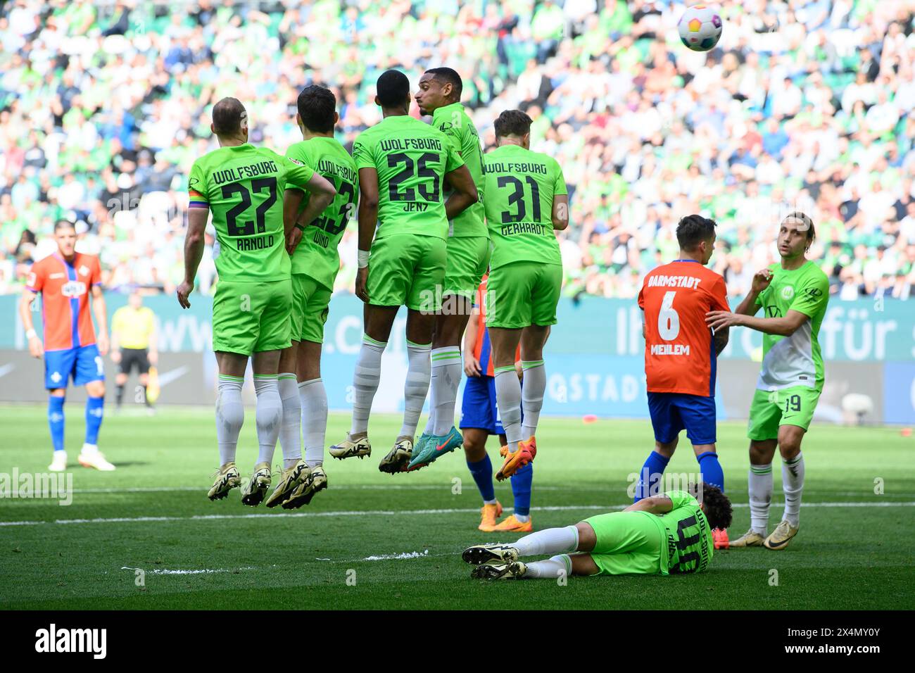 Wolfsburg, Germany. 04th May, 2024. Soccer: Bundesliga, VfL Wolfsburg - Darmstadt 98, Matchday 32, Volkswagen Arena. Wolfsburg's Kevin Paredes lies on the pitch behind the wall from a free-kick. Credit: Swen Pförtner/dpa - IMPORTANT NOTE: In accordance with the regulations of the DFL German Football League and the DFB German Football Association, it is prohibited to utilize or have utilized photographs taken in the stadium and/or of the match in the form of sequential images and/or video-like photo series./dpa/Alamy Live News Stock Photo