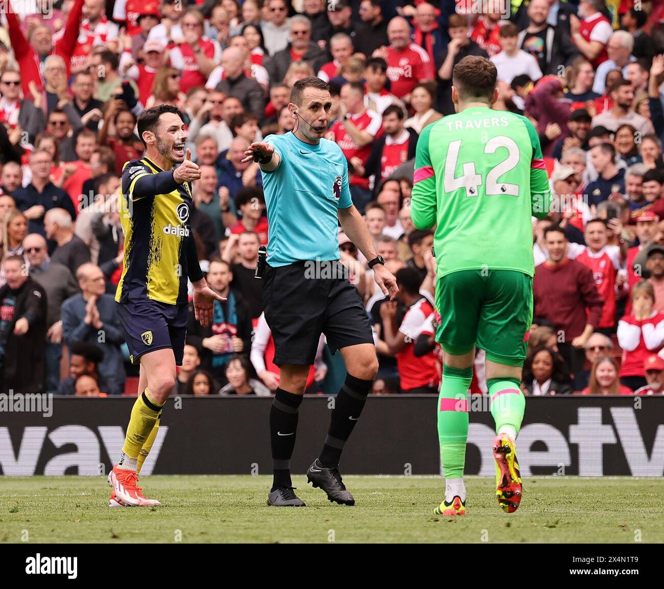London, UK. 4th May, 2024. Referee David Coote points to the spot