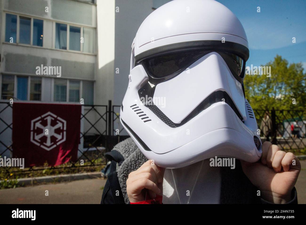 Moscow, Russia. 4th of May, 2024. A boy wears a stormtrooper mask during the Star Wars day celebration in Moscow, Russia. Star Wars Day is celebrated every 04 May by many fans in different parts of the world. Credit: Nikolay Vinokurov/Alamy Live News Stock Photo