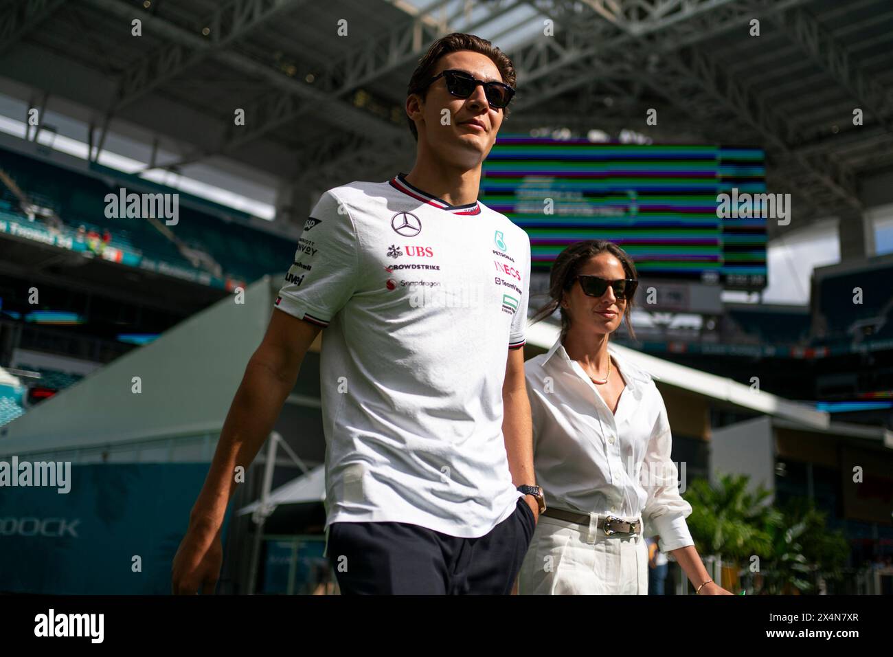 Miami Gardens, United States. 04th May, 2024. British Formula One driver George Russell of Mercedes-AMG Petronas and Carmen Montero Mundt arrive to the paddock during the Formula One Miami Grand Prix at the Miami International Autodrome in Miami Gardens, Florida on Saturday, May 4, 2024 Photo by Greg Nash/UPI. Credit: UPI/Alamy Live News Stock Photo