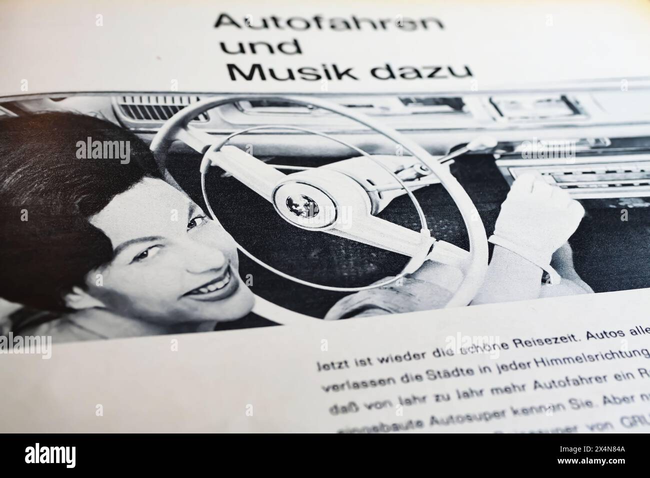 Viersen, Germany - May 1. 2024: Vintage advertising for Grundig car stereo radio with woman setting station in german magazine from 1960 Stock Photo