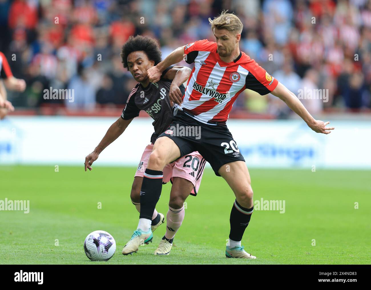 London, UK. 4th May, 2024. Willian of Fulham and Kristoffer Ajer of Brentford challenge for the ball during the Premier League match at Gtech Community Stadium, London. Picture credit should read: Paul Terry/Sportimage Credit: Sportimage Ltd/Alamy Live News Stock Photo